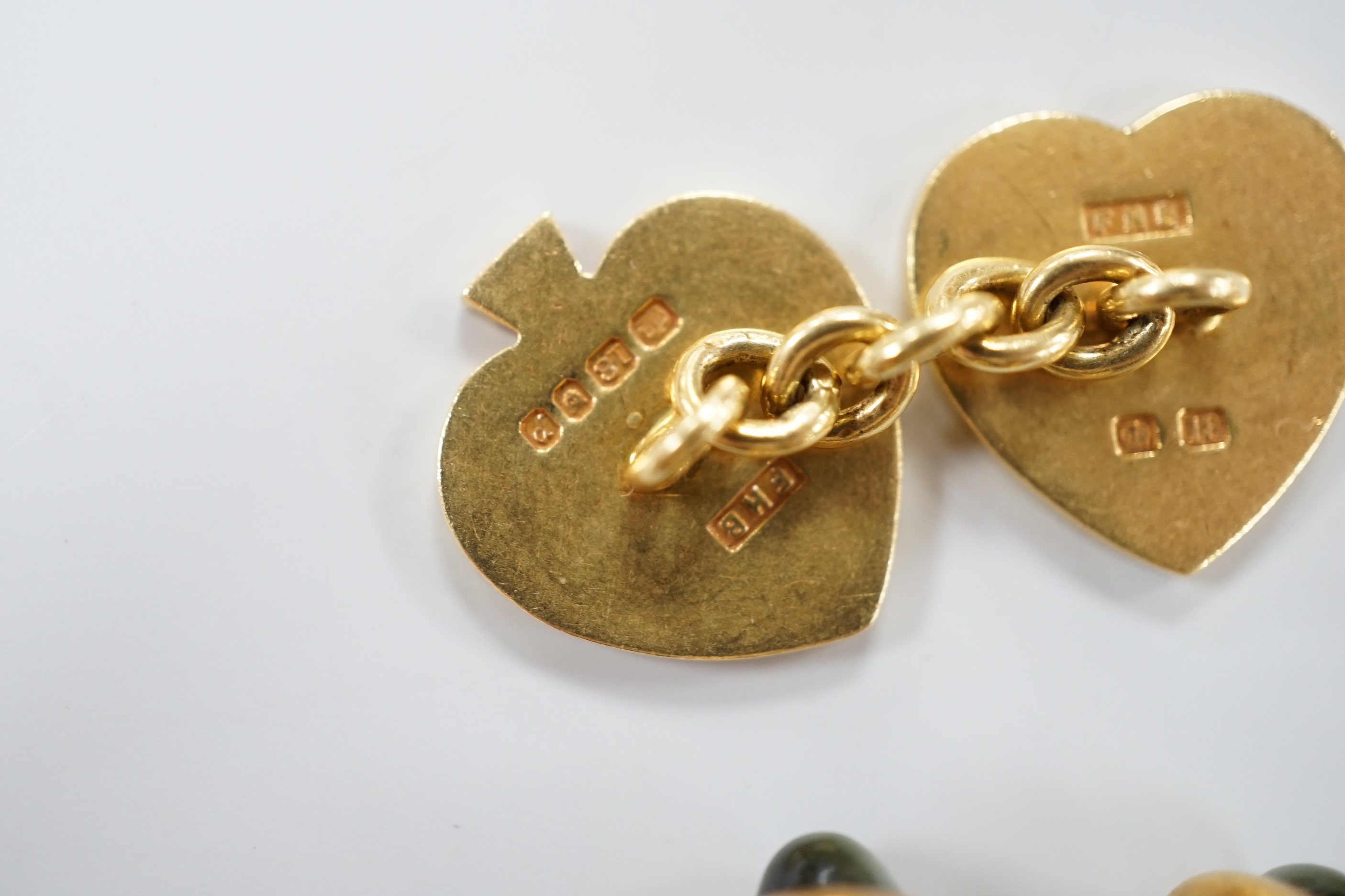 A pair of early 1970's 18ct gold novelty playing card suite cufflinks, 16 grams, together with three yellow metal and cat's eye chrysoberyl set dress studs.